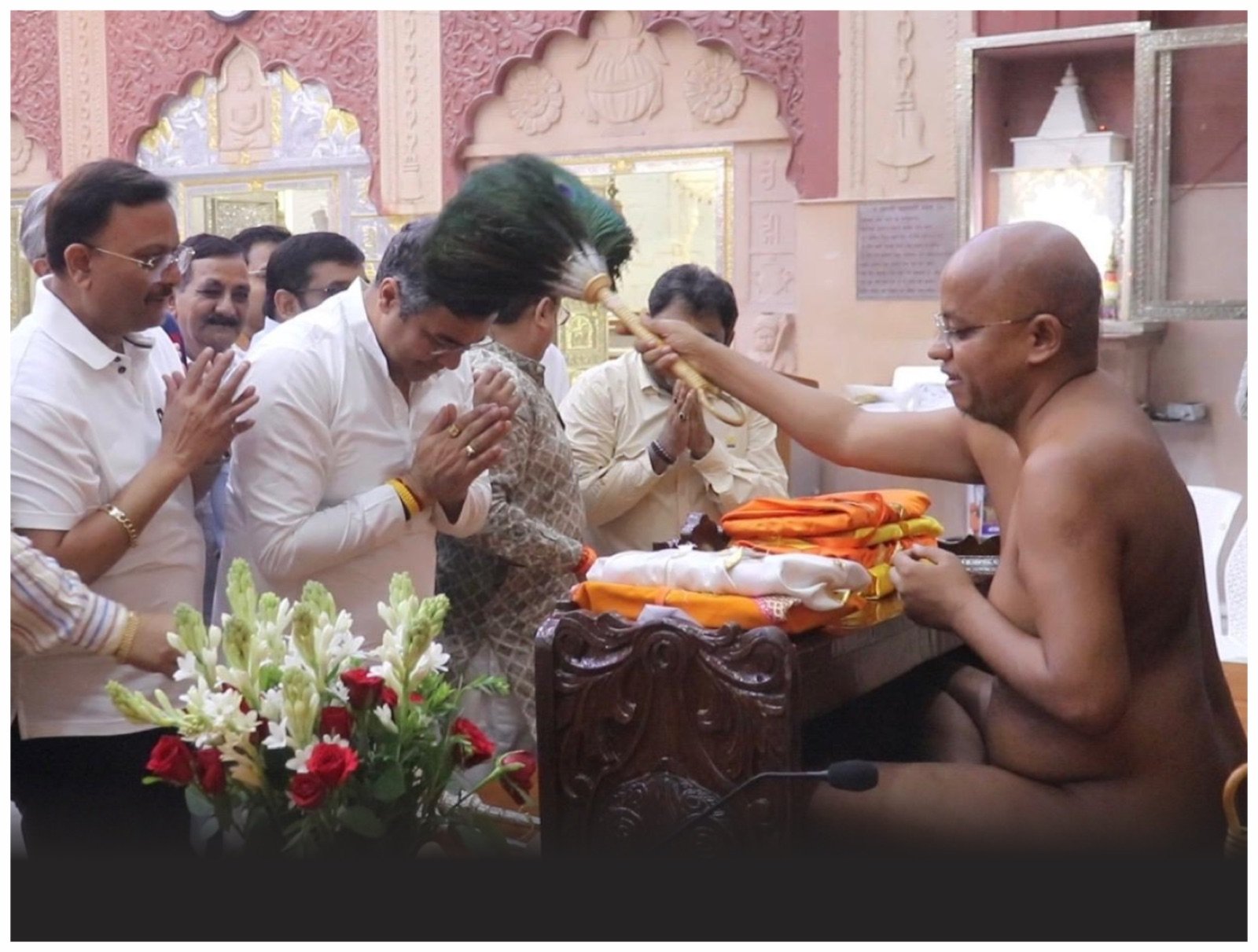 Blessing devotees at a mandir